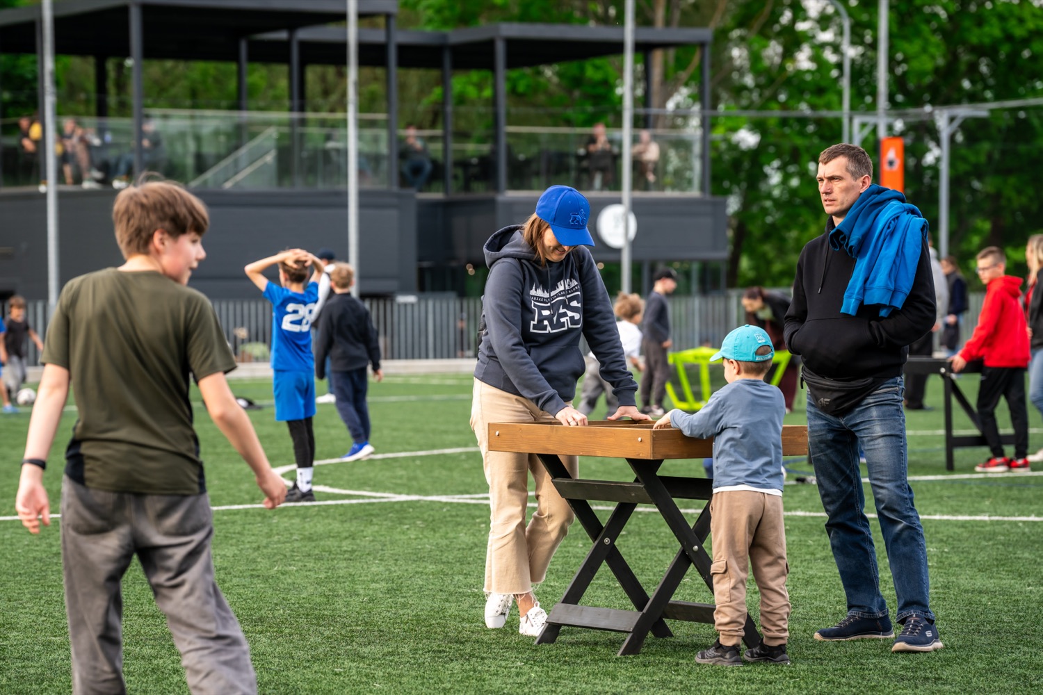 A family playing a table game at an event