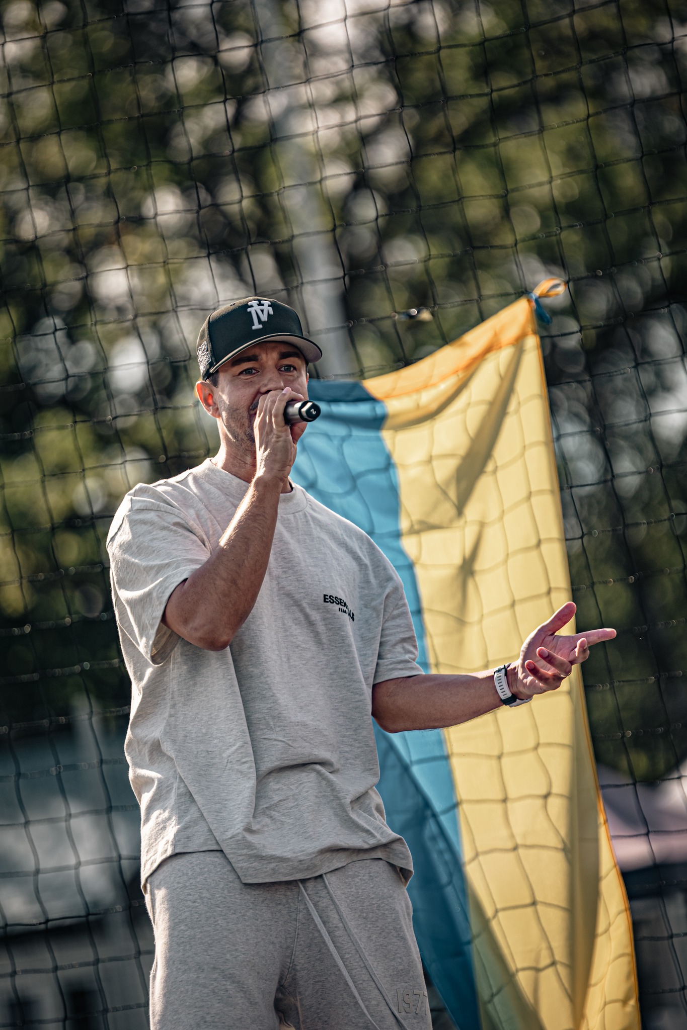 May be an image of 1 person, playing tennis, track and field and text