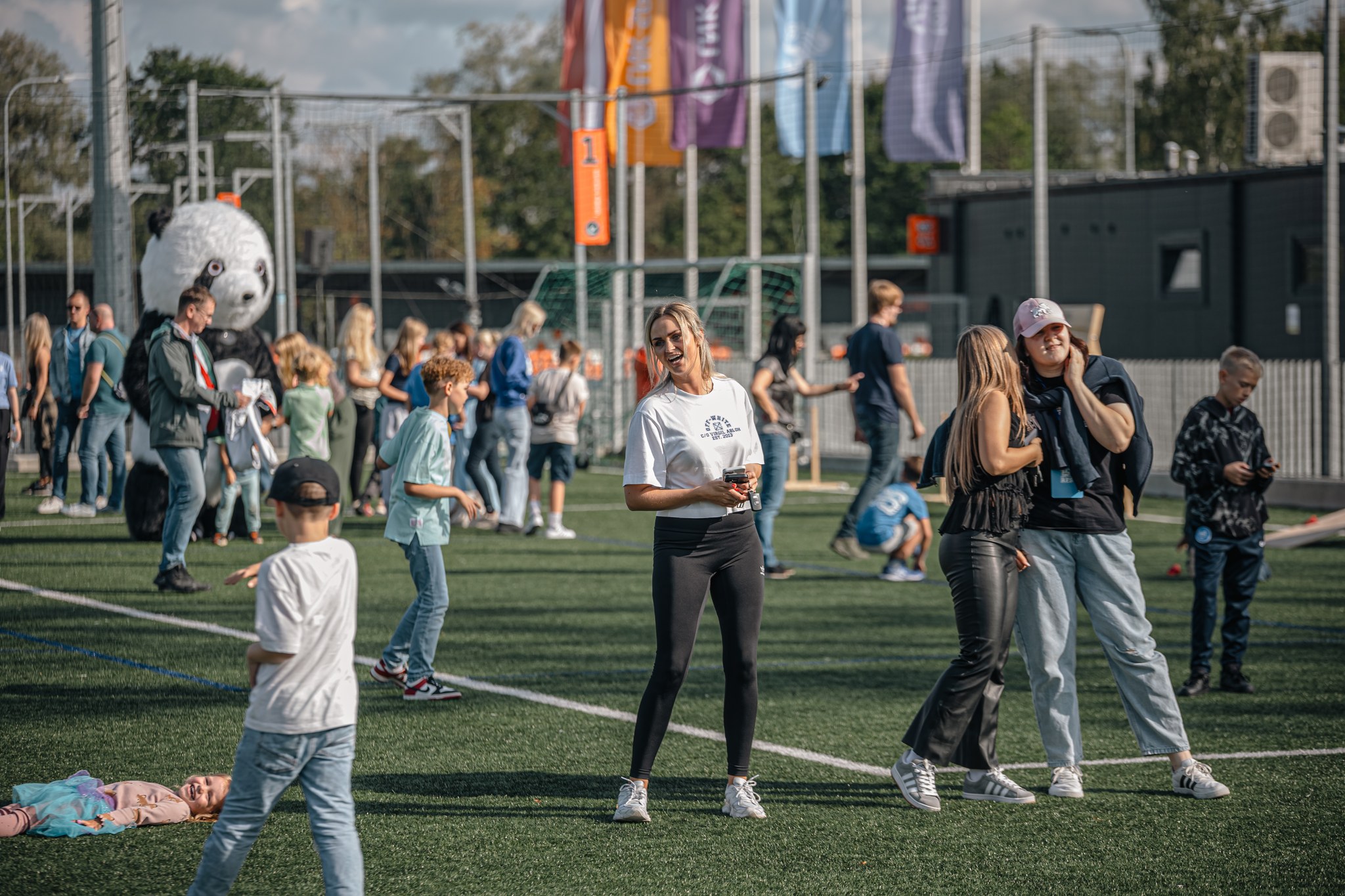 May be an image of 12 people, people playing soccer, people playing football, frisbee and crowd