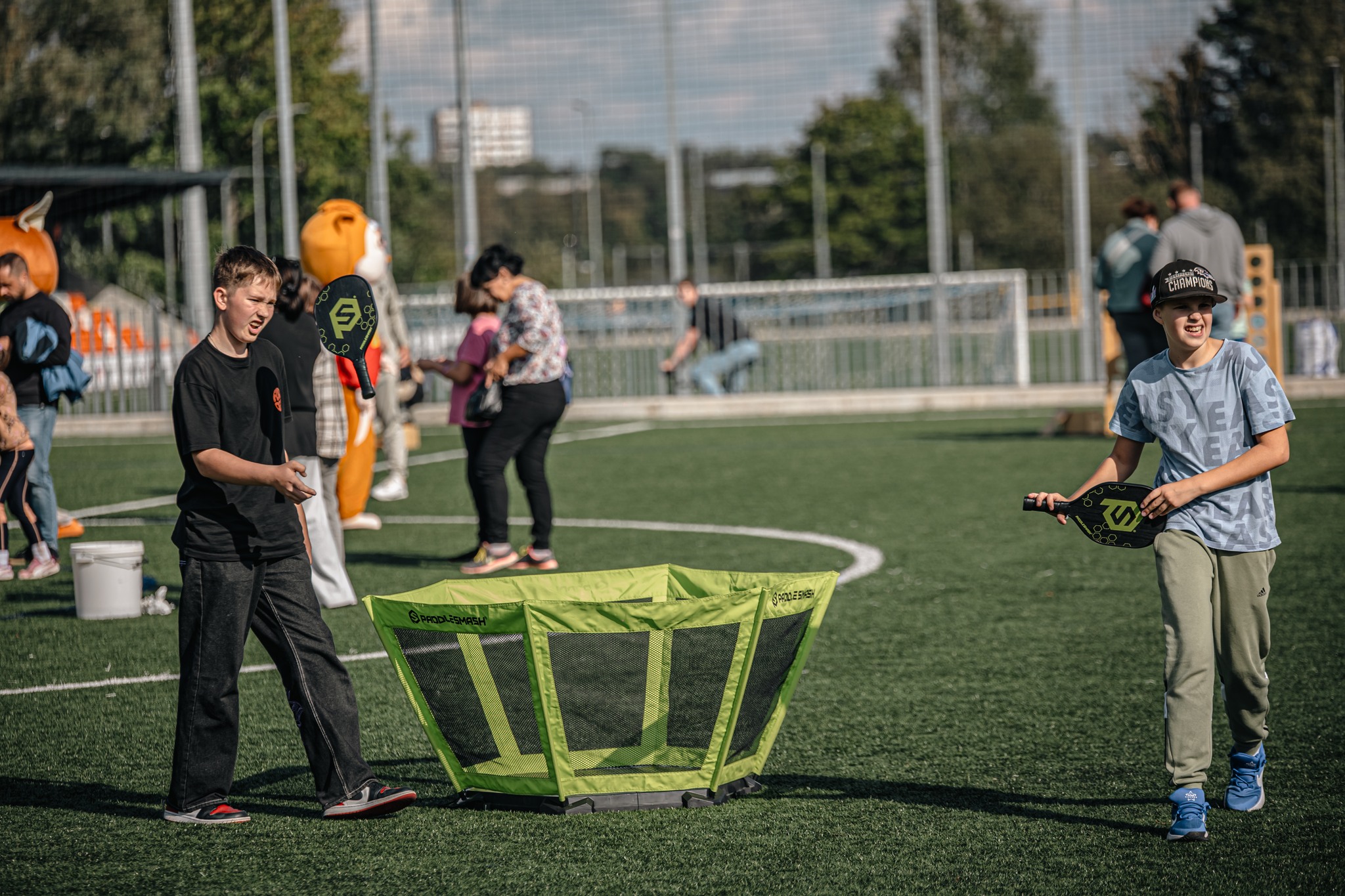 May be an image of 8 people, child, people playing tennis, people golfing, people playing soccer and frisbee