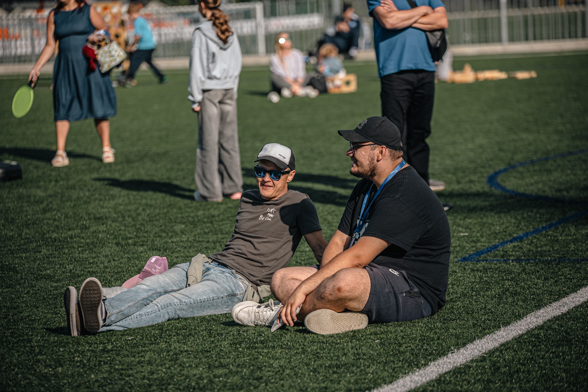 May be an image of 9 people, frisbee and grass
