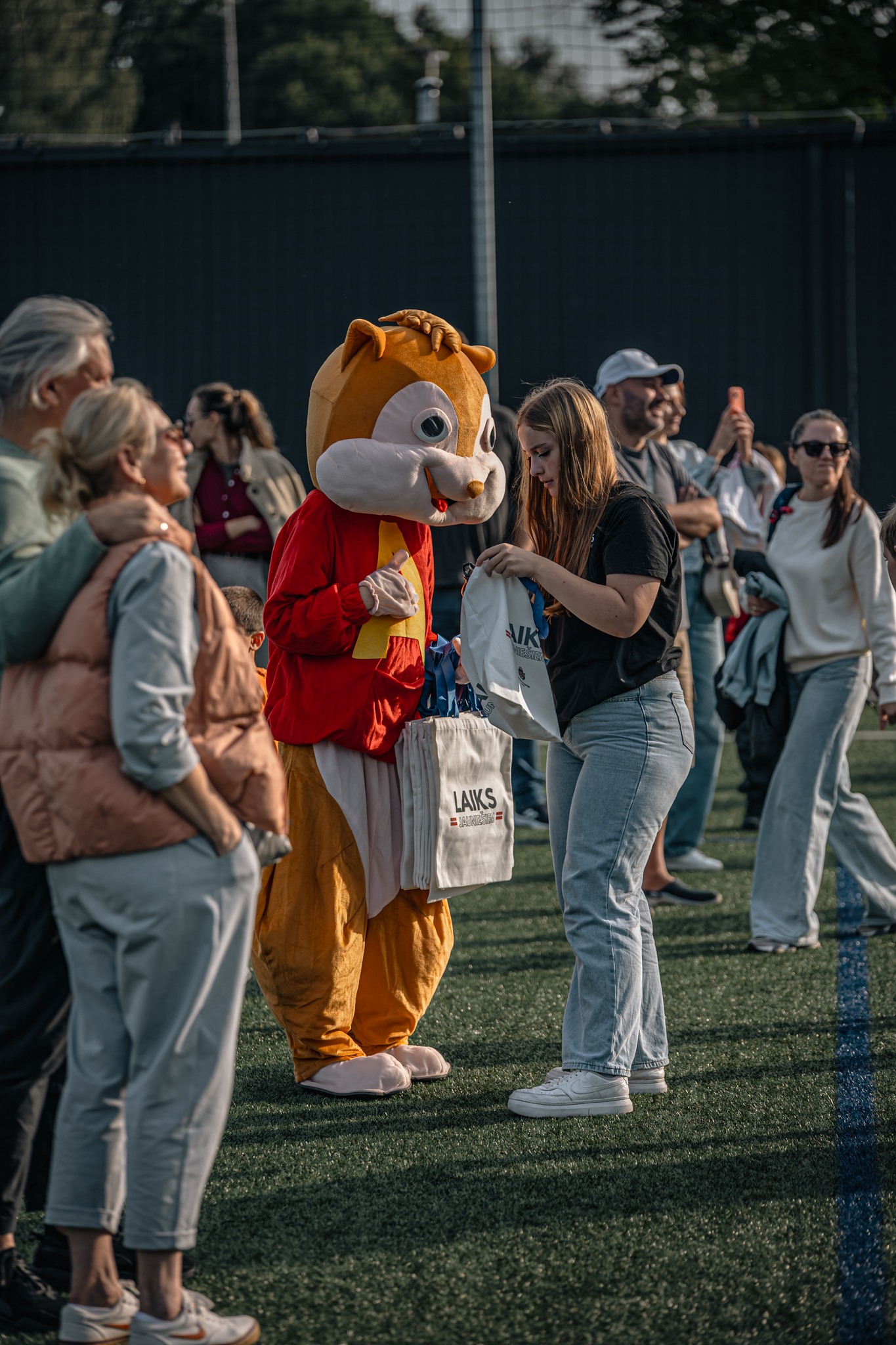 May be an image of 4 people and crowd