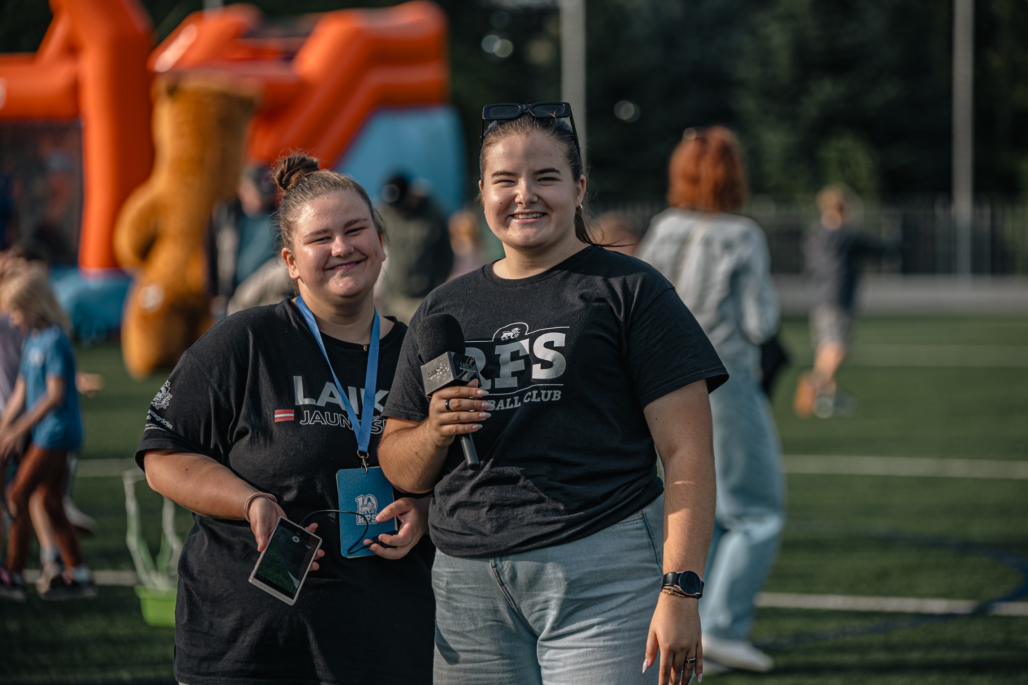 May be an image of 5 people, people smiling, grass and text