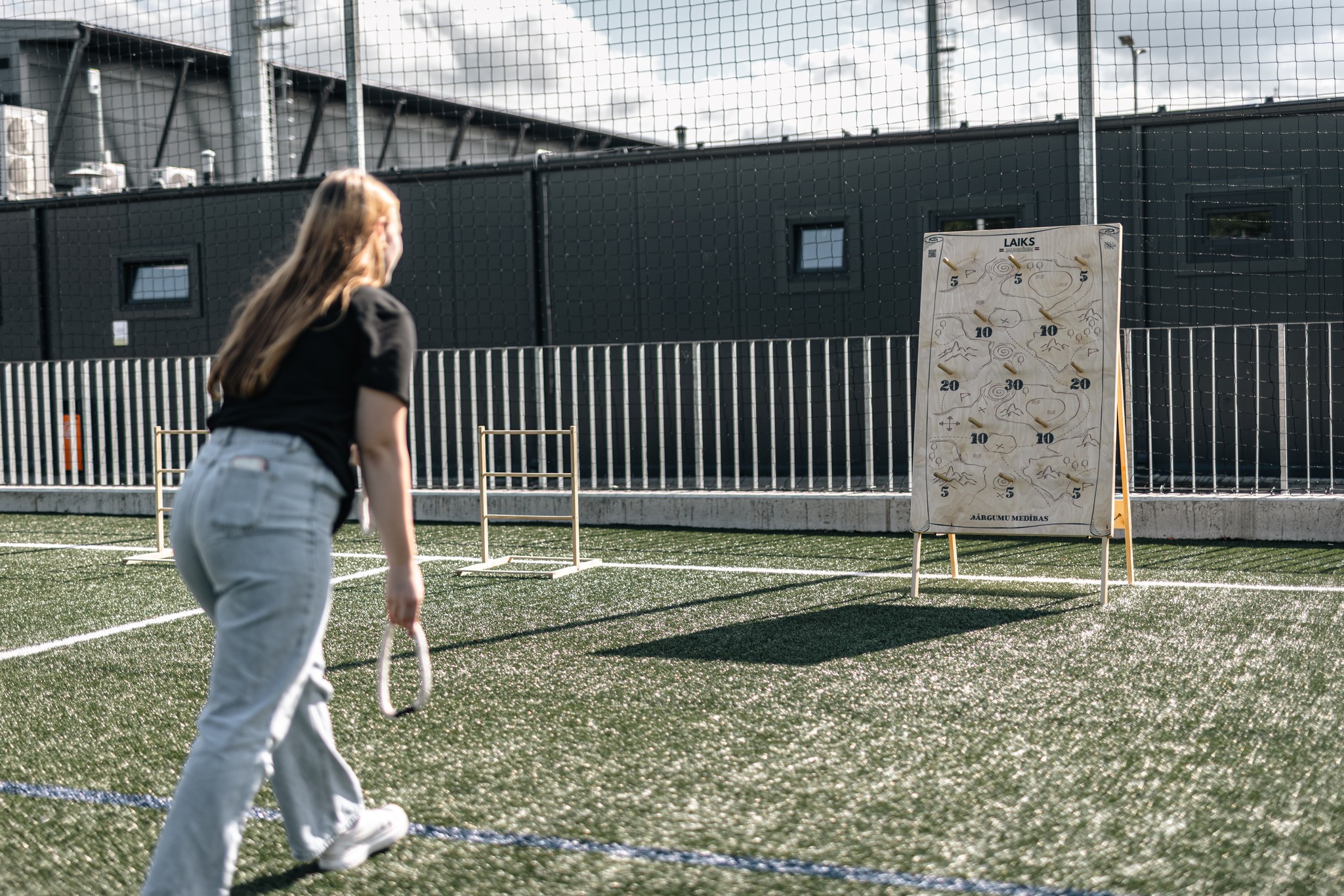 May be an image of 1 person, track and field, golfing, skeet shooting, dartboard, frisbee and grass