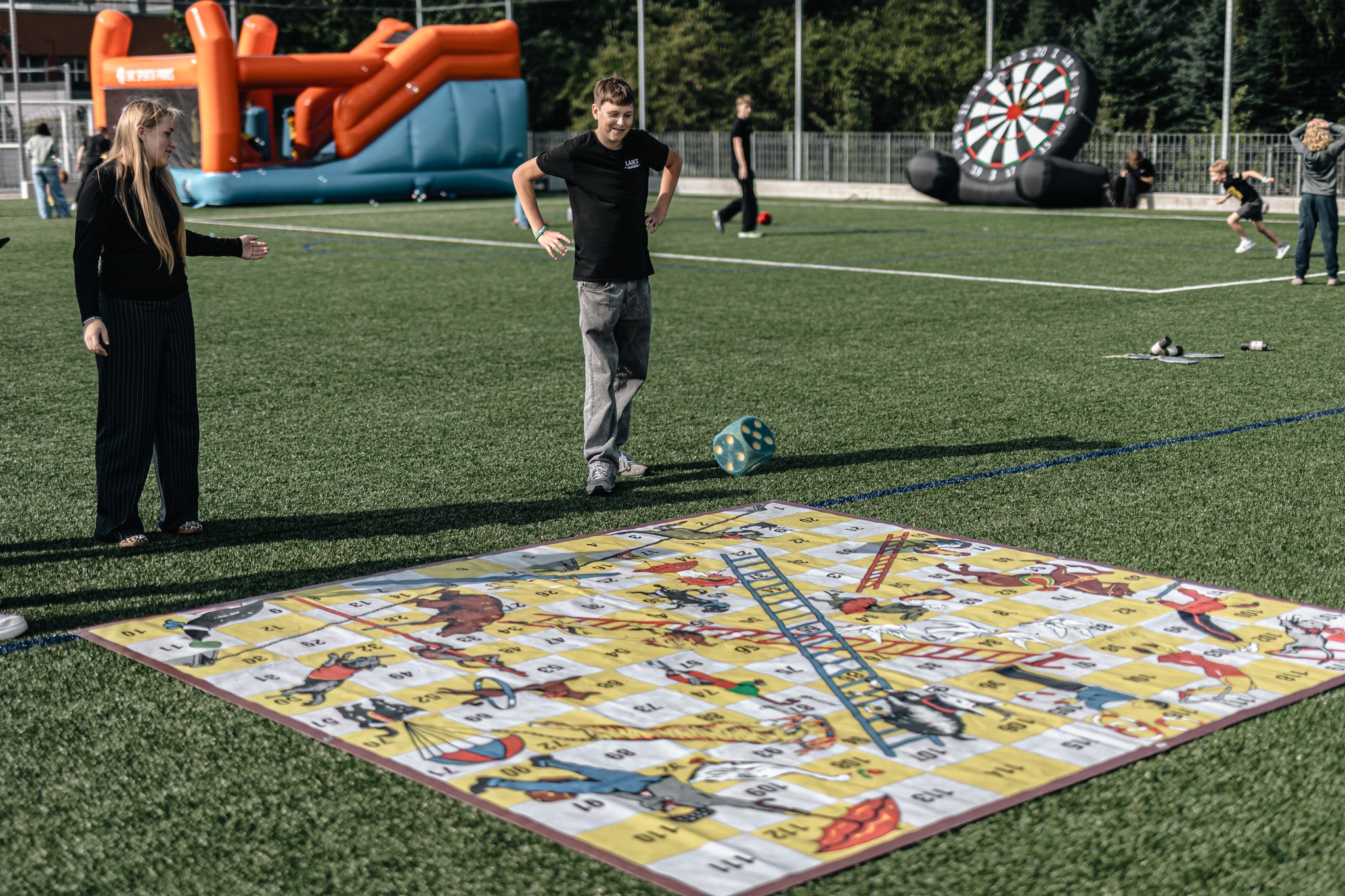 May be an image of 7 people, people playing soccer, people playing football, frisbee and text