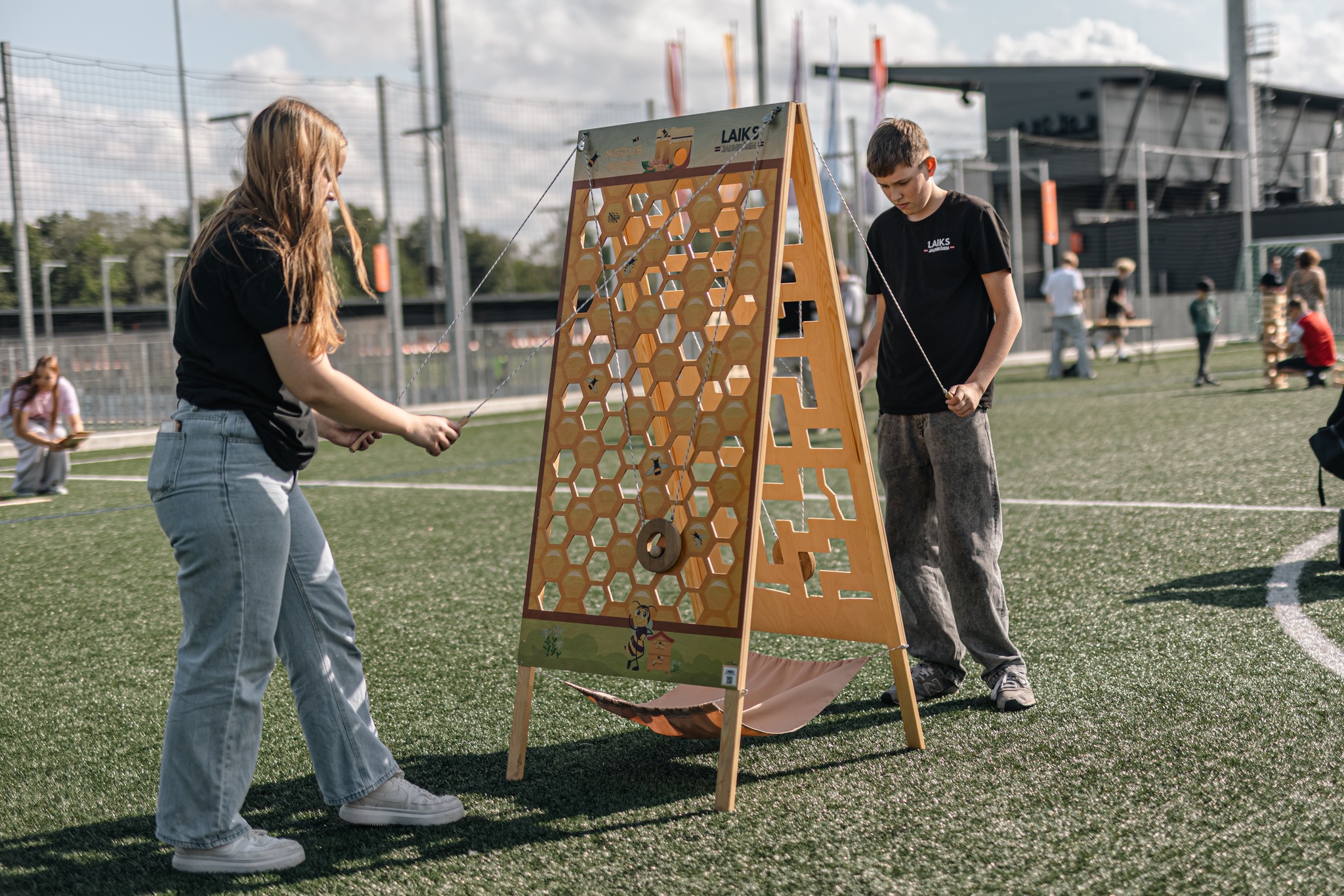 May be an image of 8 people, people playing soccer, people playing football, people golfing, frisbee and grass