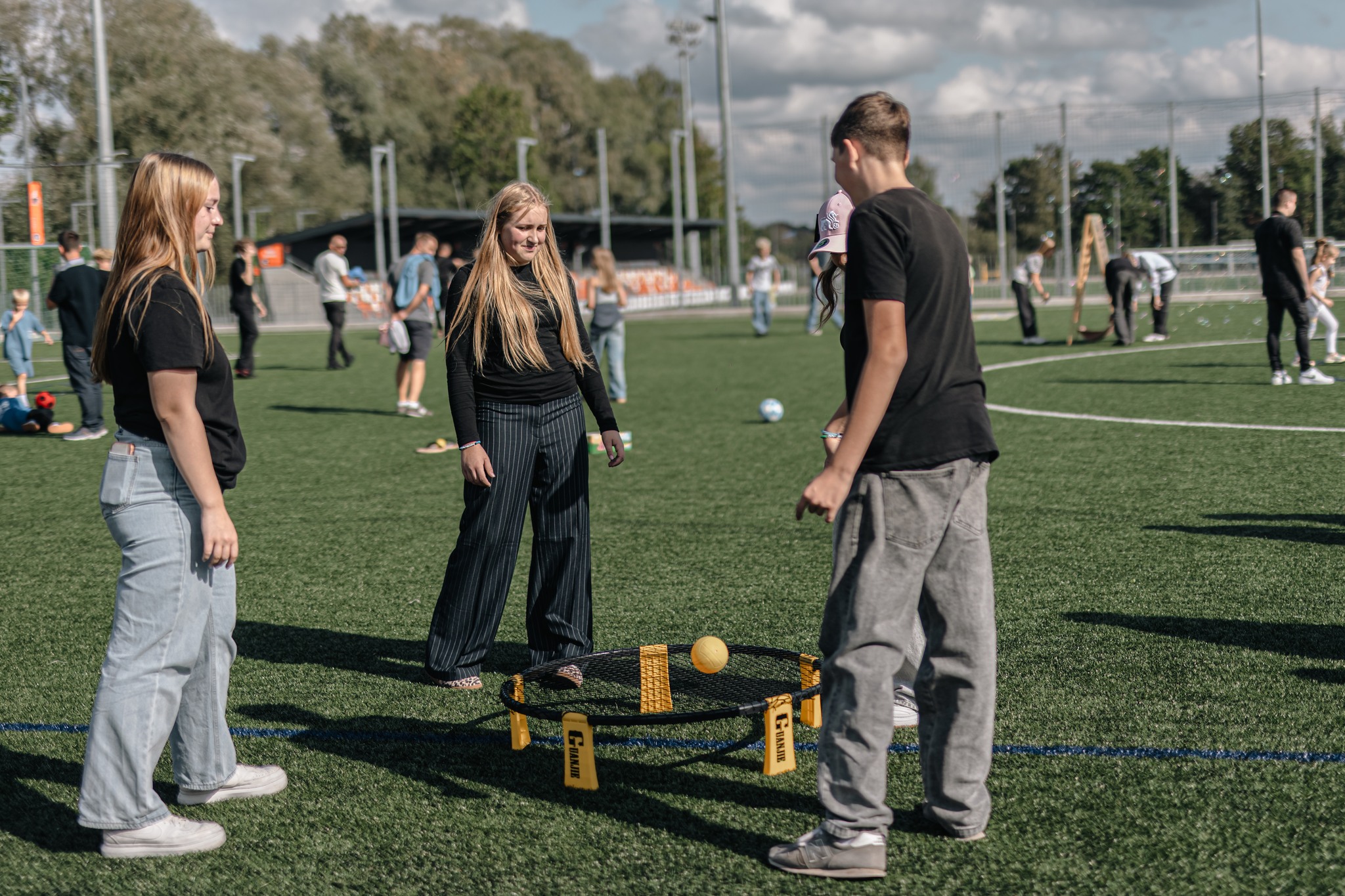 May be an image of 14 people, people playing soccer, people playing football, frisbee and grass