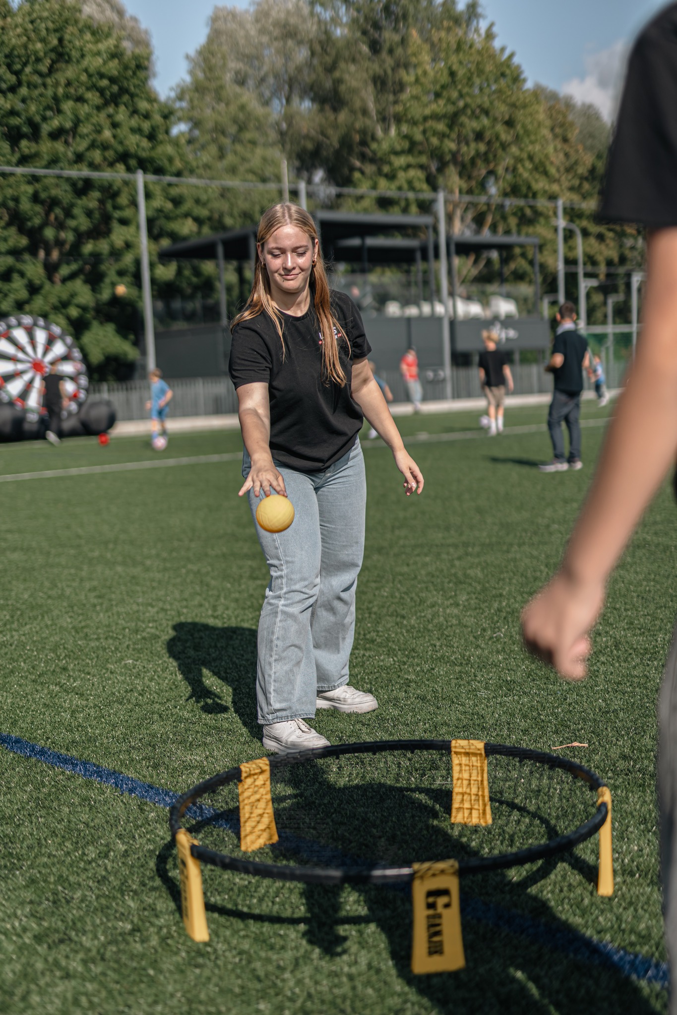 May be an image of 5 people, people playing football, people playing soccer, people playing tennis, trampoline and frisbee