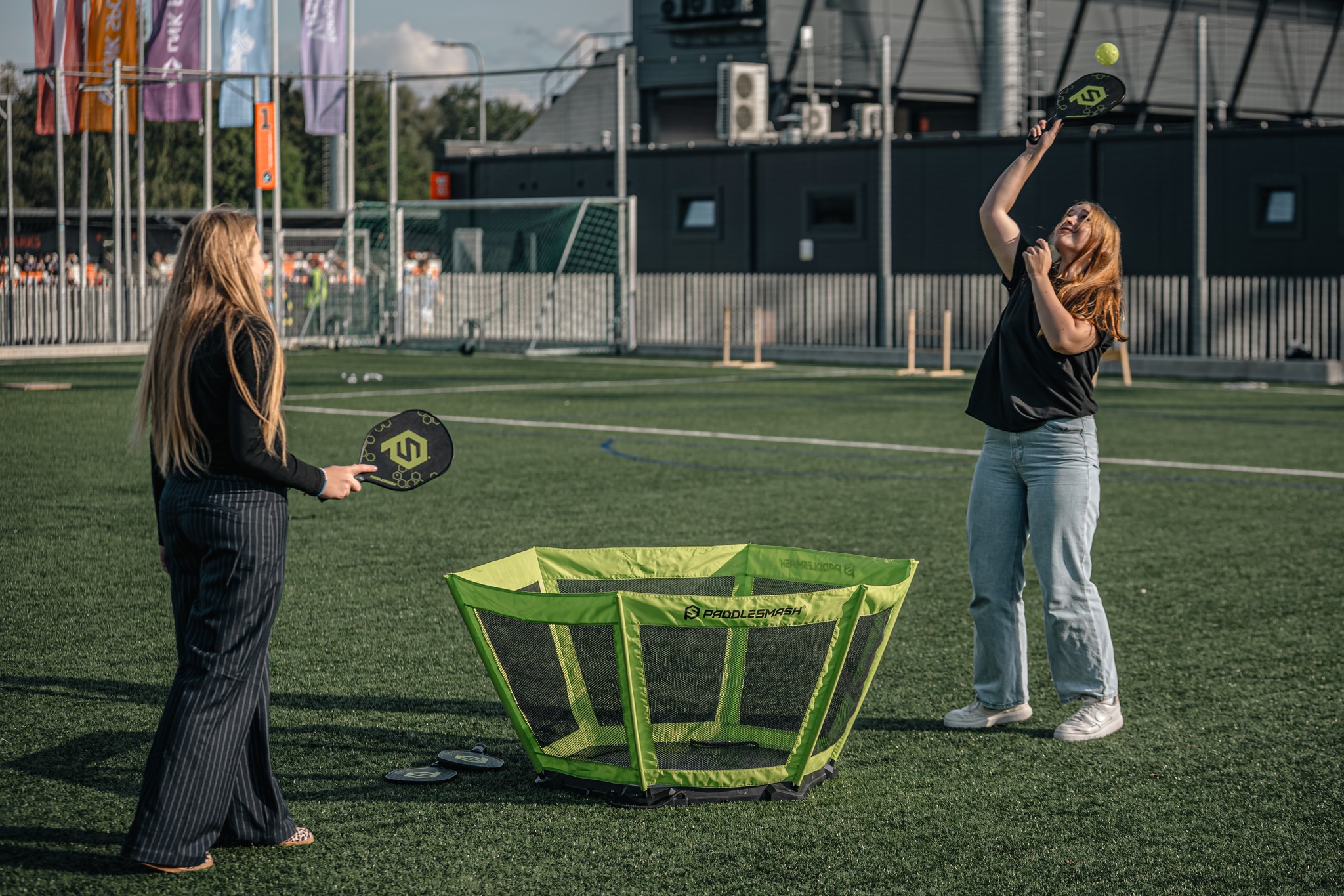 May be an image of 3 people, people golfing, people playing soccer, people playing football, people playing tennis, frisbee and grass