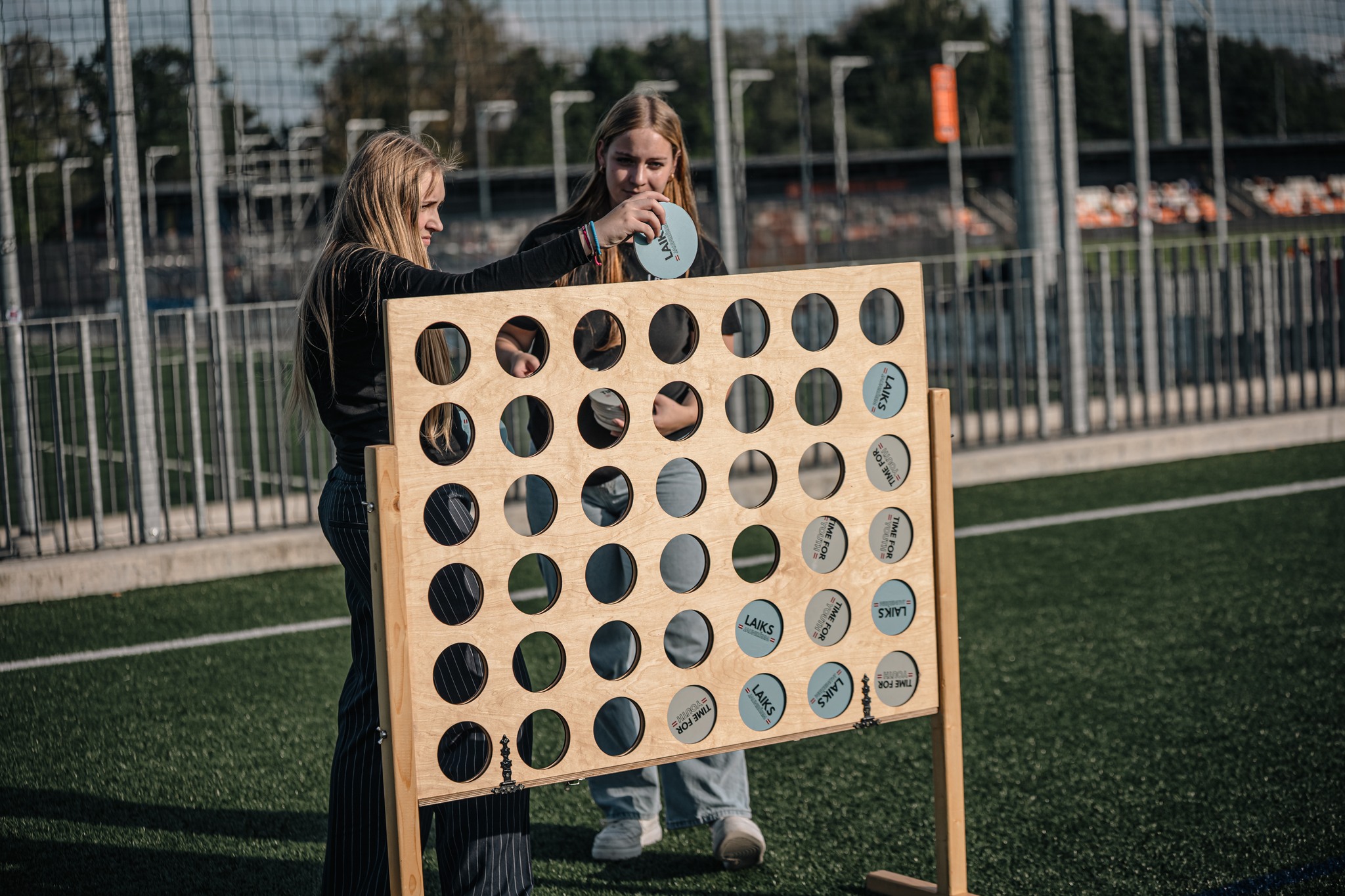 May be an image of 2 people, people playing soccer and frisbee