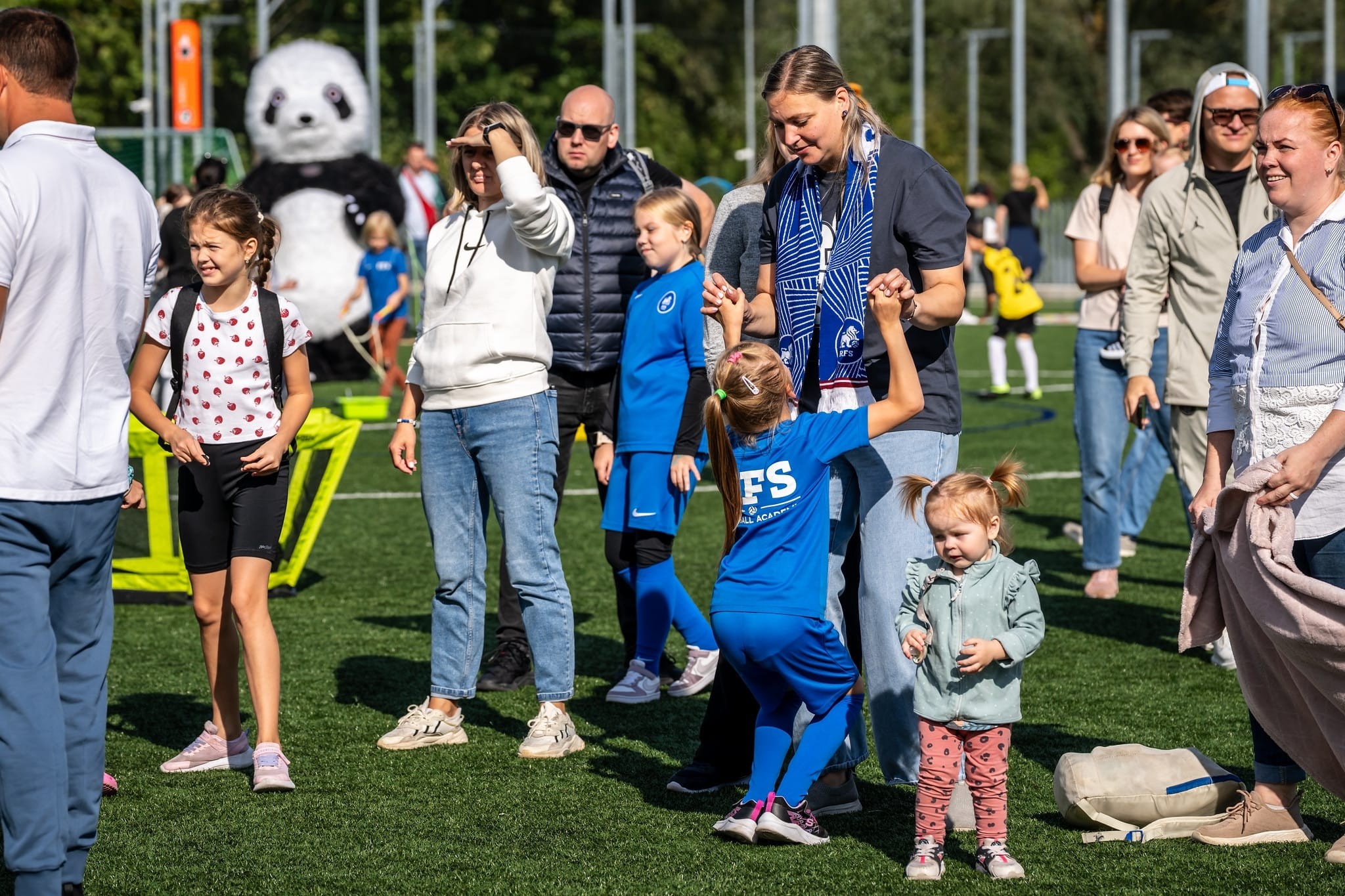 May be an image of 10 people, people playing soccer, people playing football and grass