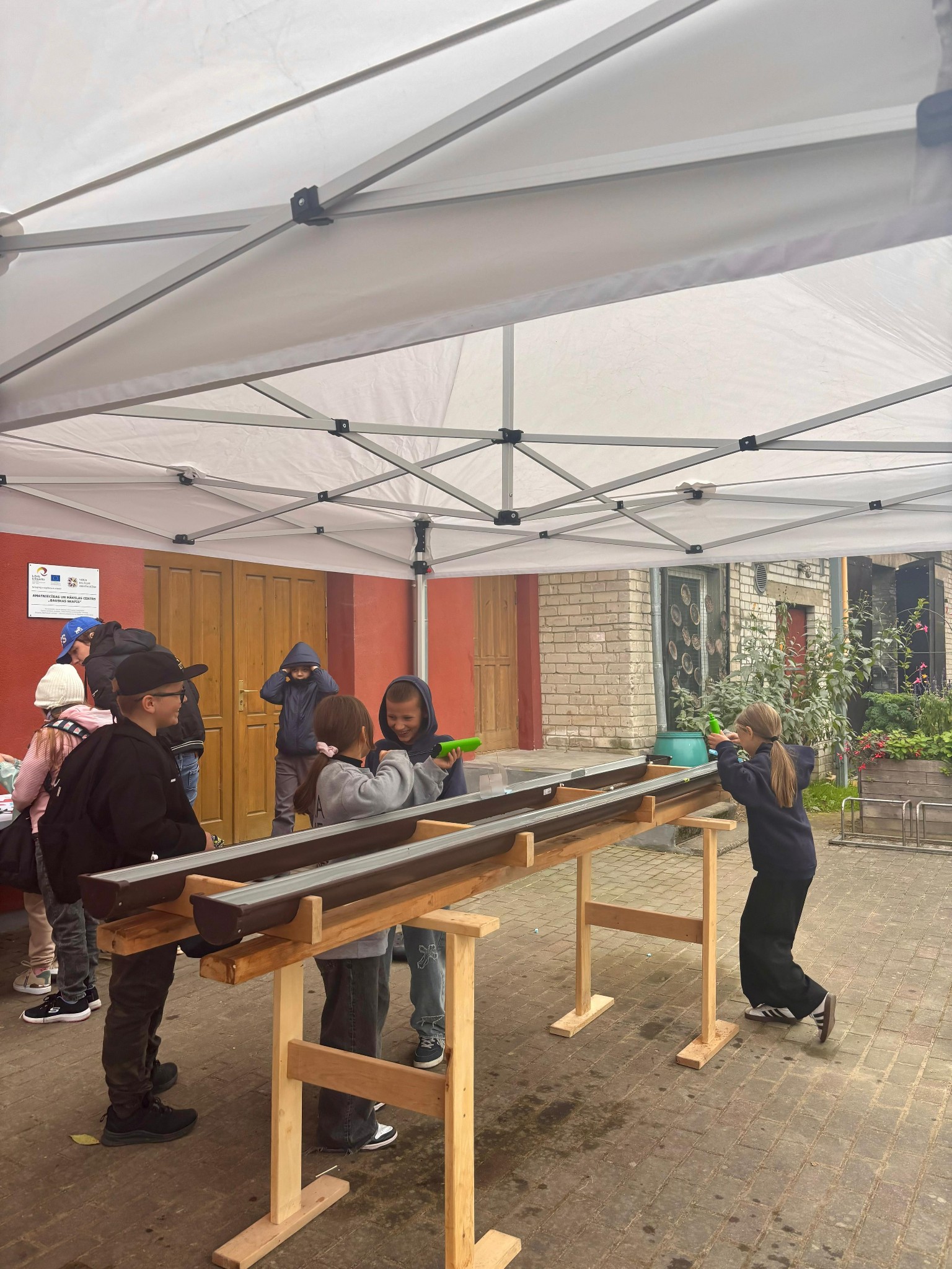 May be an image of 5 people and lumberyard