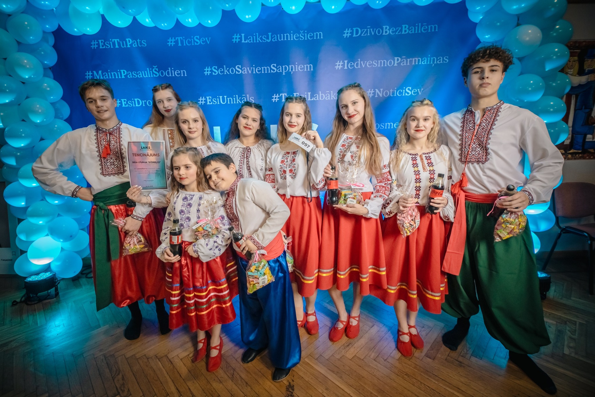 May be an image of one or more people, dirndl and text that says '#EsiTuPats #TiciSev #MainiPasauliSodien #DzivoBezBailem EsiDTO #LaiksJauniešiem #SekoSaviemSapniem mSappiem#IedvesmoParmainas #IedvesmoPărmainas #NoticiSev #EsiUnikals #T-r #T-TiLabak Labak TE4WAWИE Gay oSme 情家究 -'