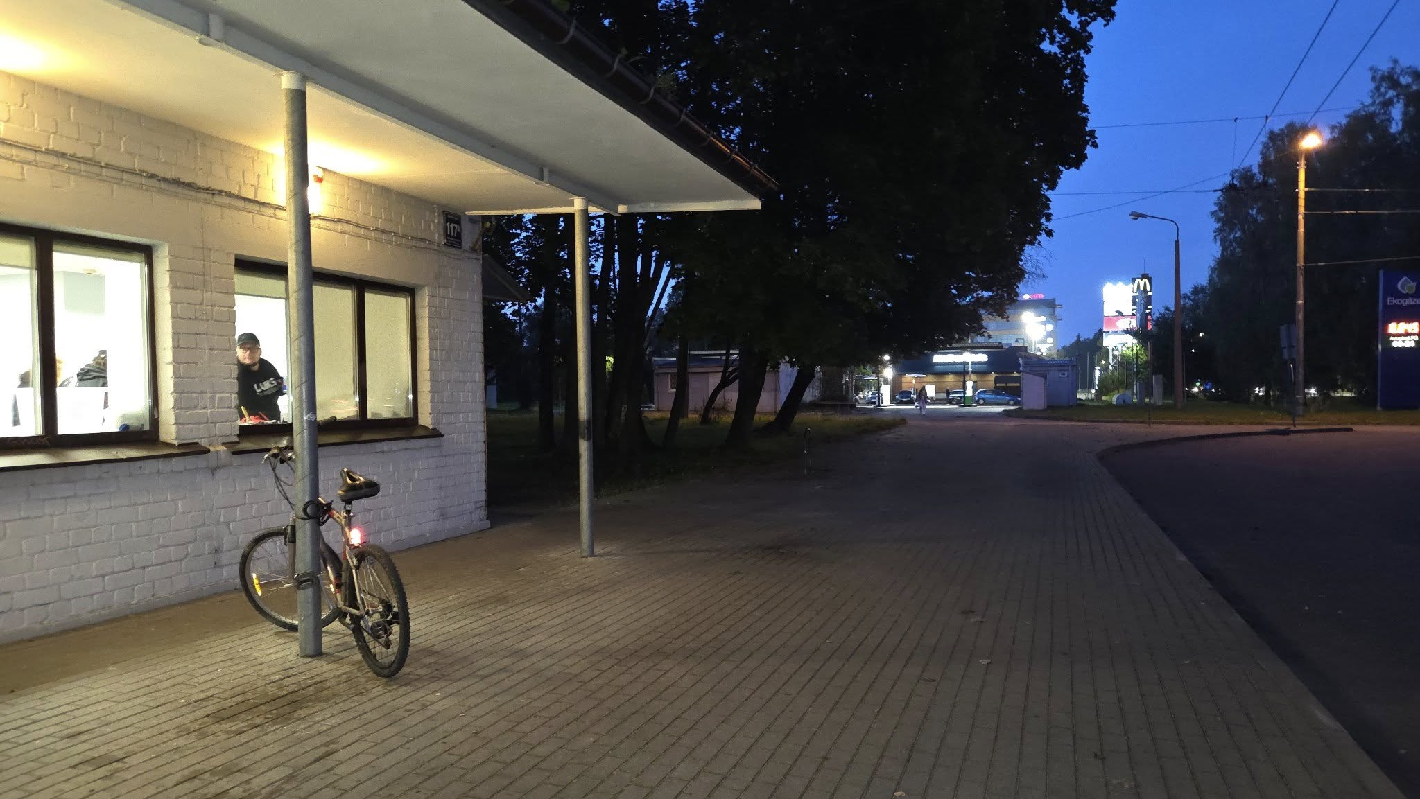 May be an image of 1 person, bicycle, street and road