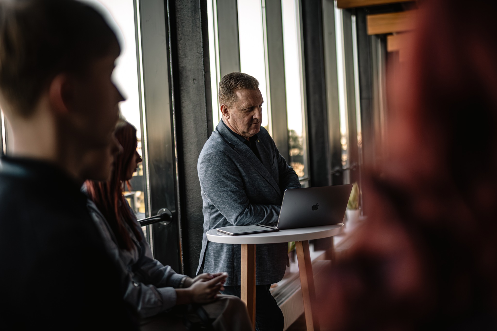 May be an image of 2 people and people studying