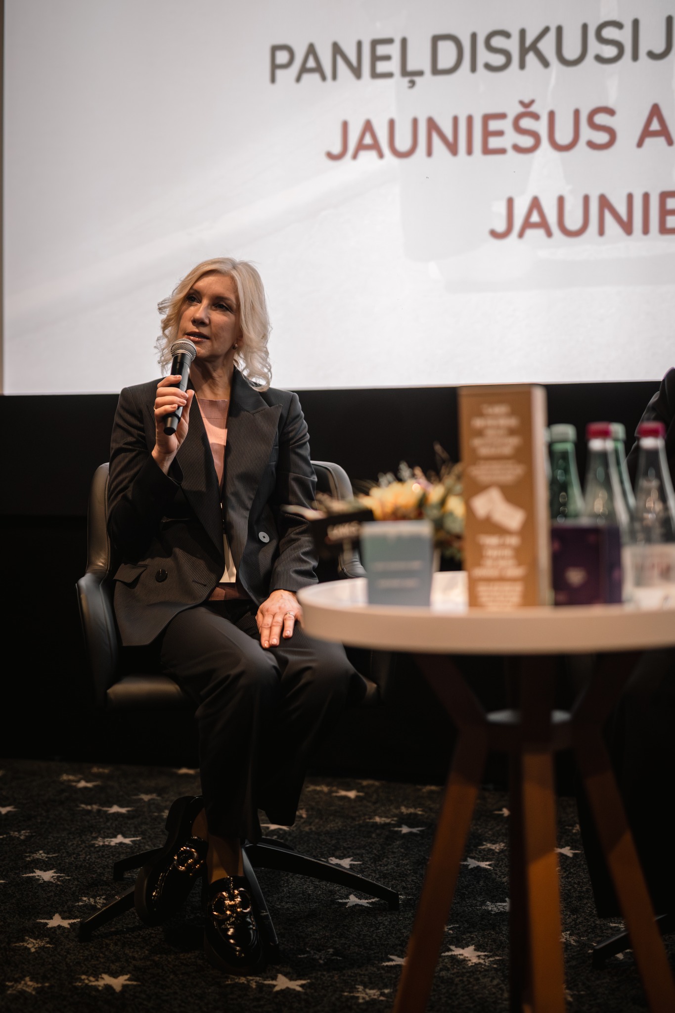 May be an image of 1 person and text that says 'PANEL PANELDISKUSIJ JAUNIEŠUS A JAUNI'