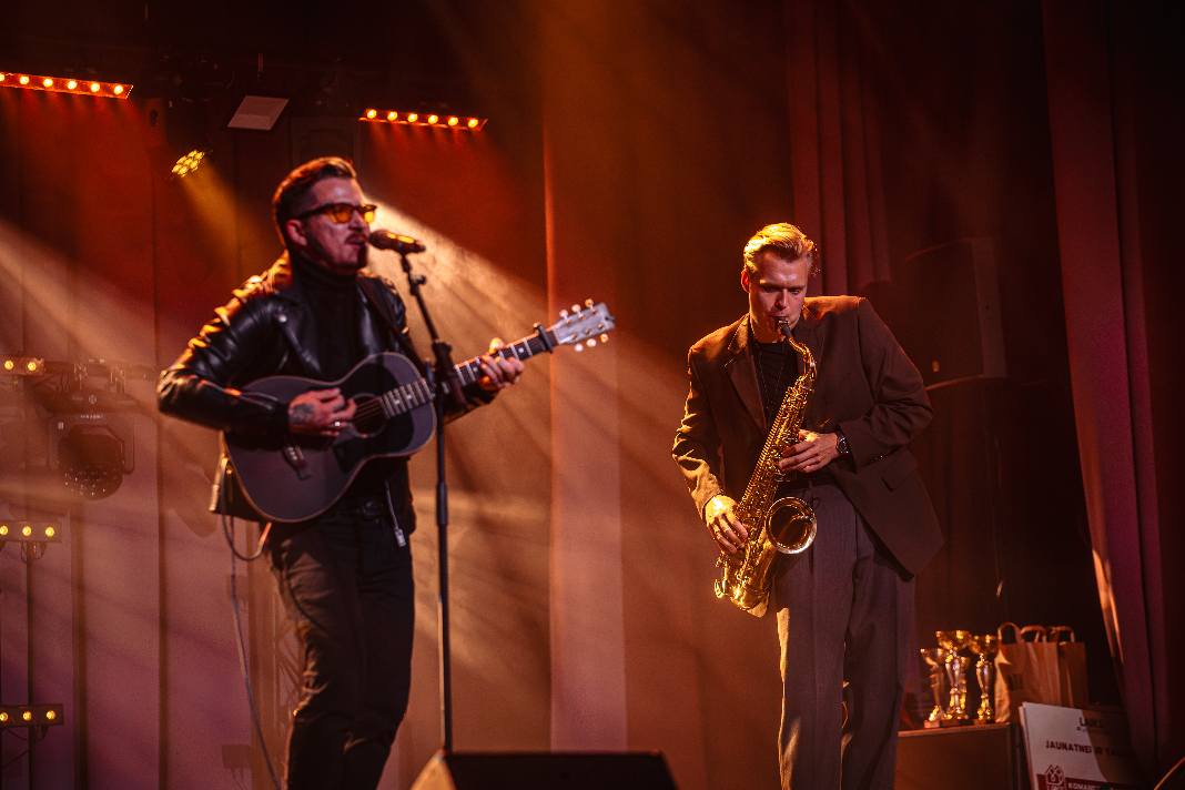 May be an image of guitar and saxophone