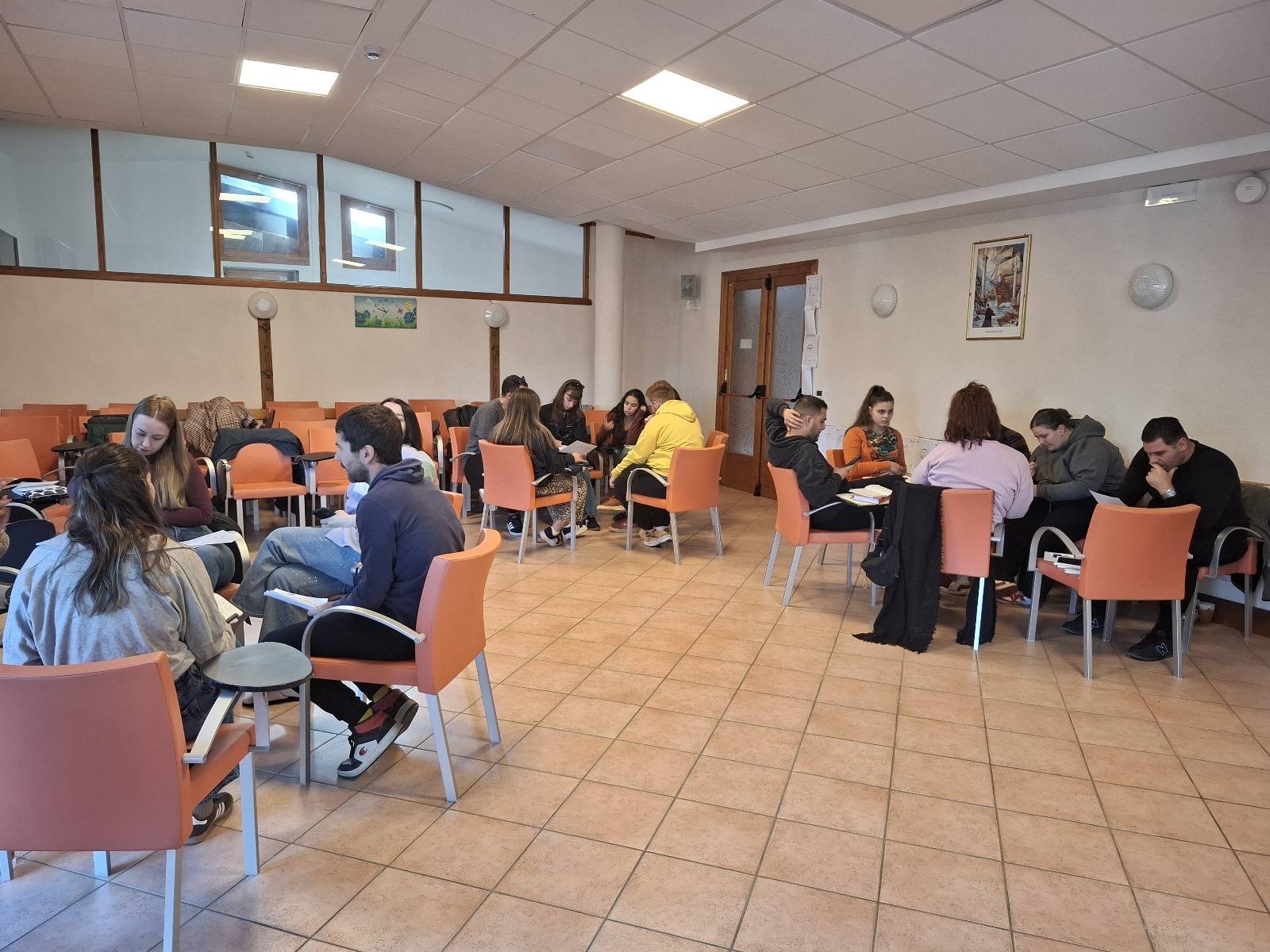 May be an image of one or more people, people studying, table and text