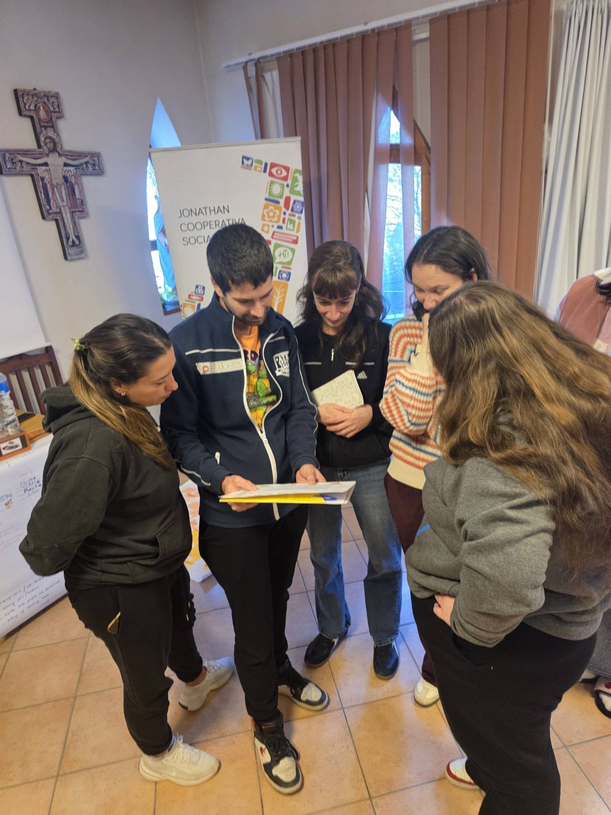 May be an image of studying and text that says 'JONATHAN COOPERATIVA SOCI នំ Saa'