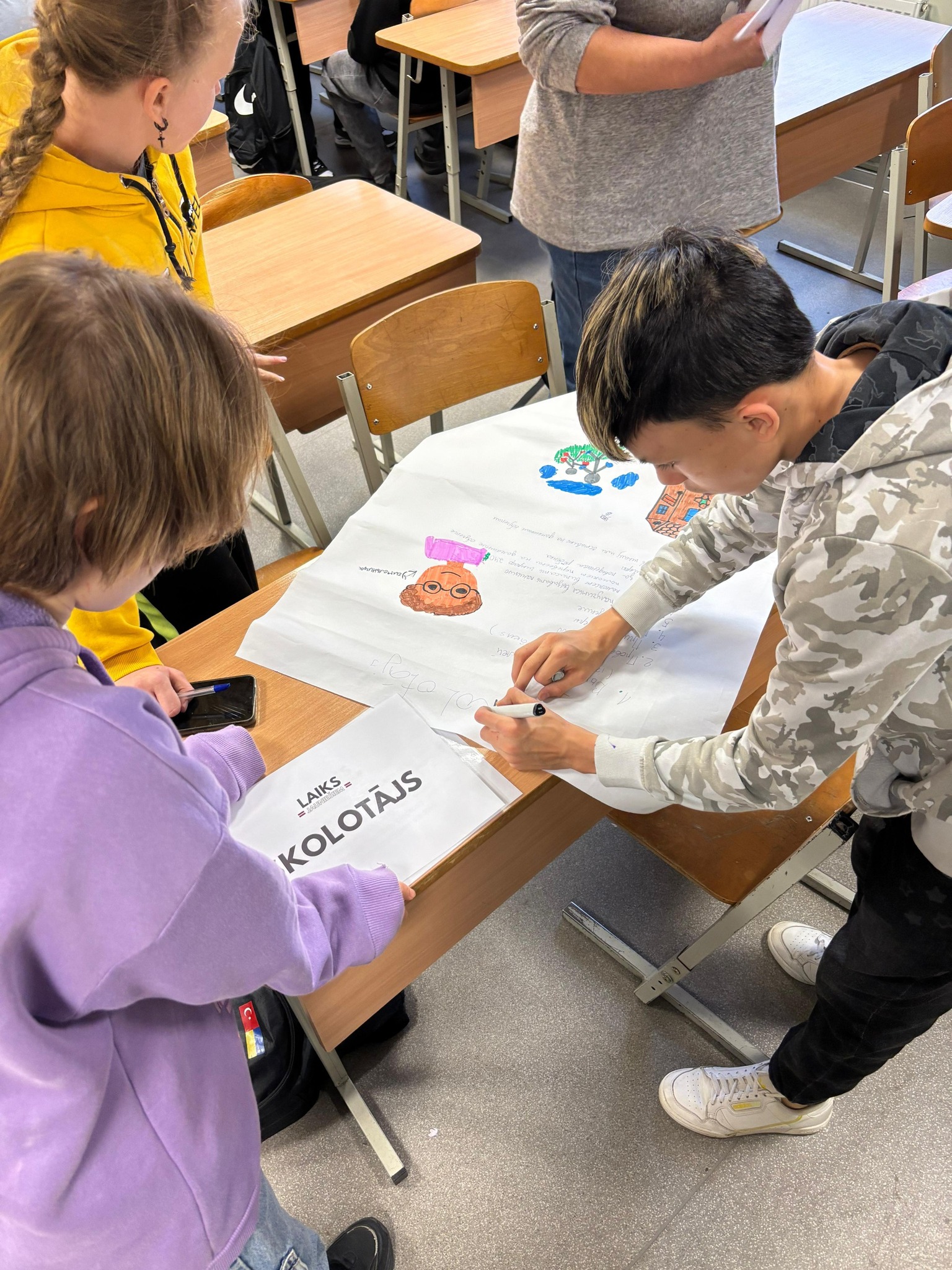 May be an image of studying and text