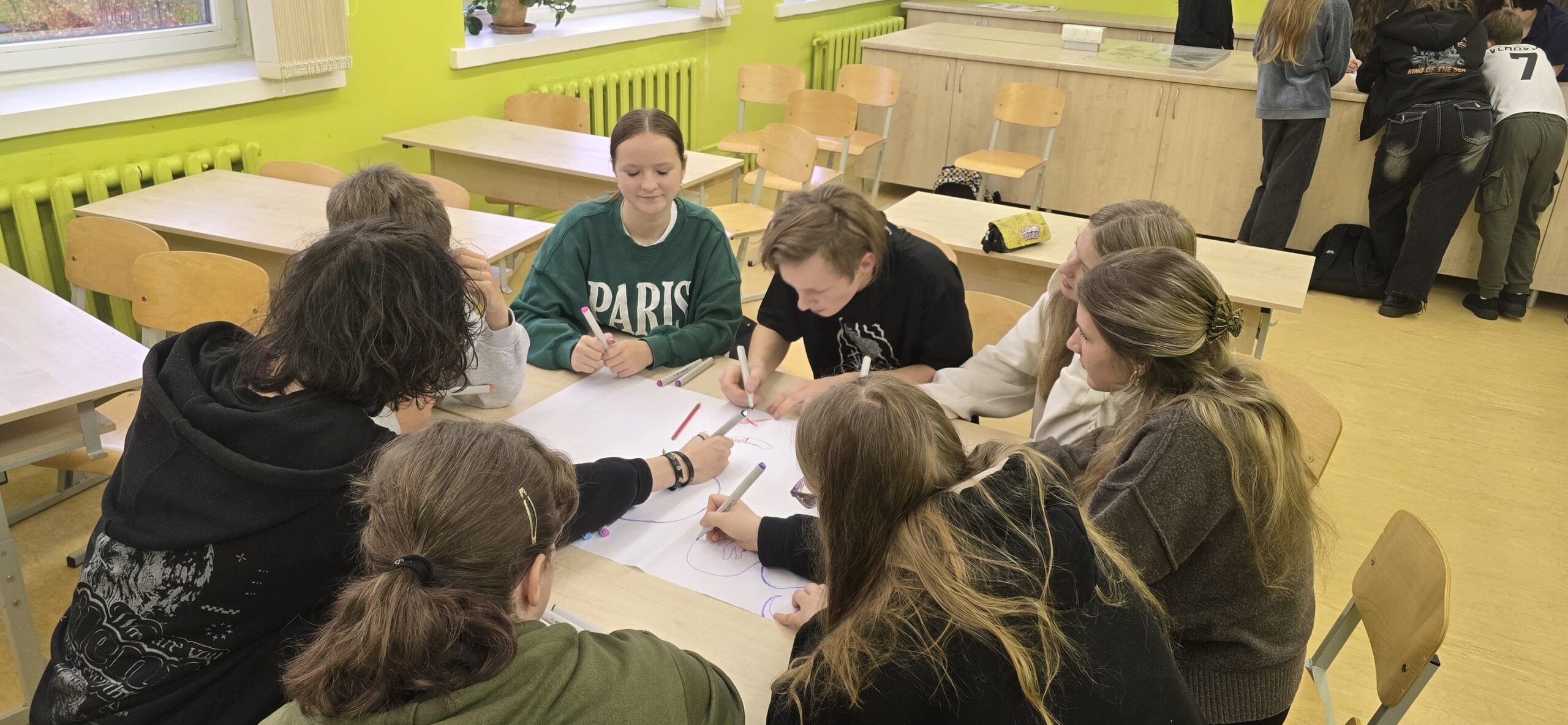 May be an image of studying, table and text