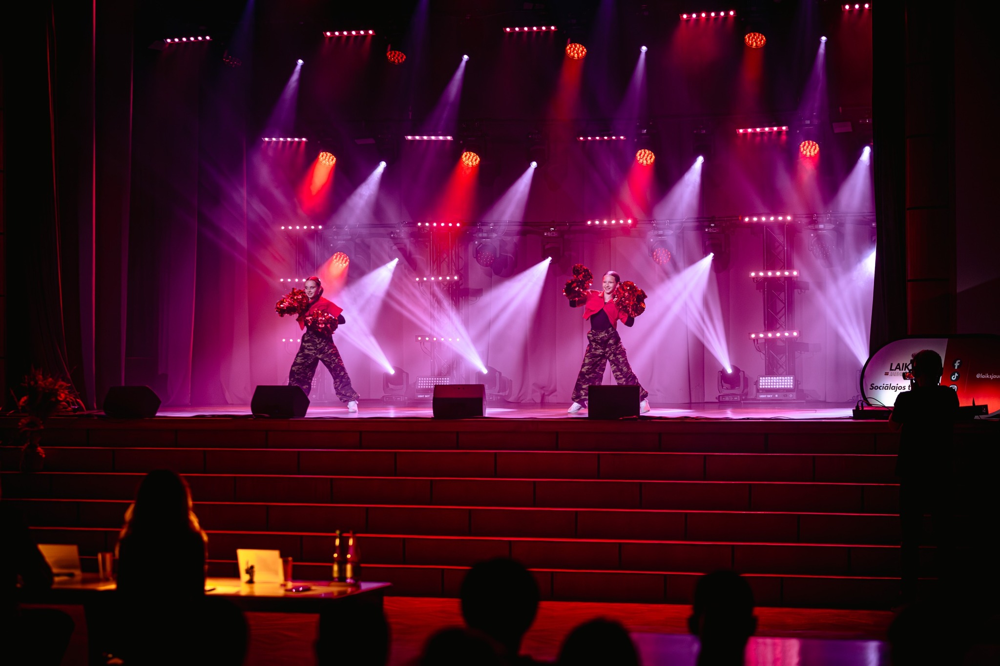 May be an image of speaker, lighting and violin