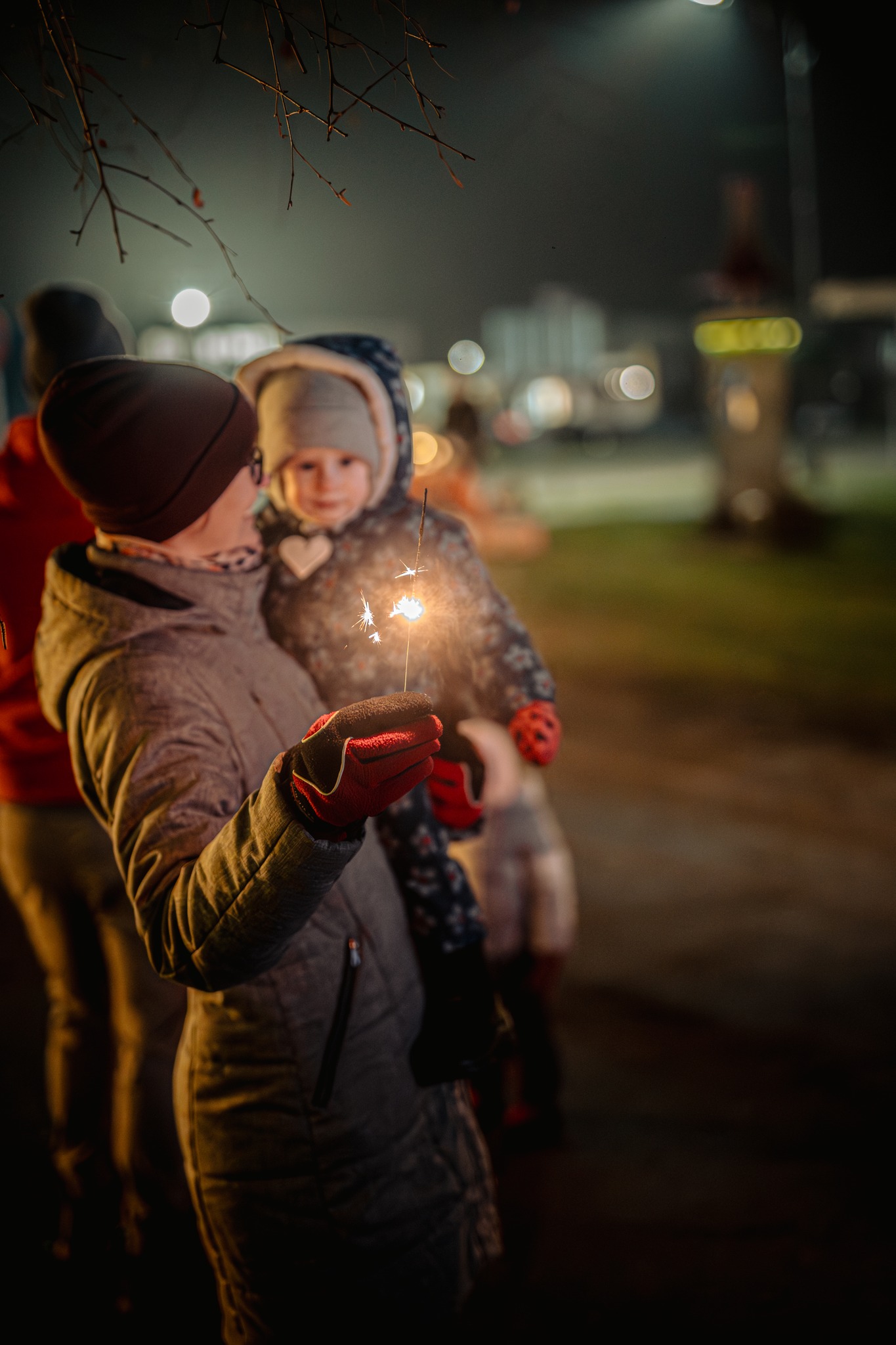 May be an image of child and fireworks