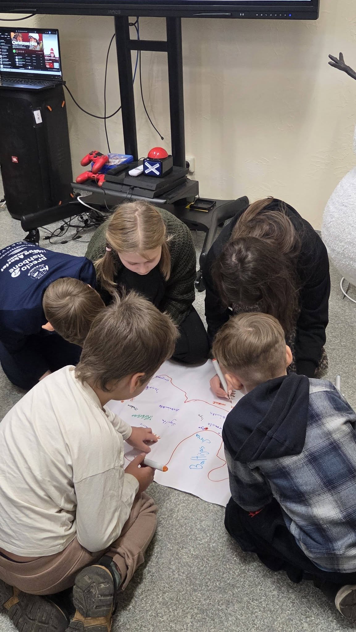 May be an image of studying and television