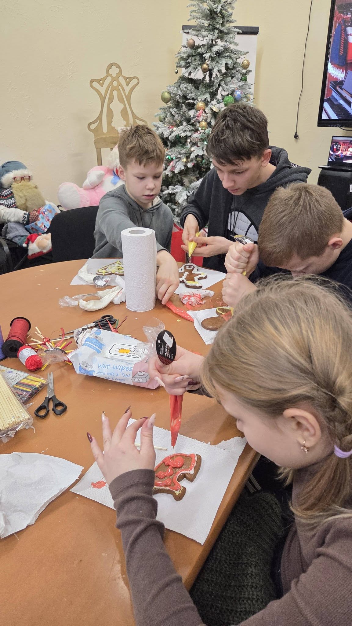 May be an image of studying, christmas tree and gingerbread cookie