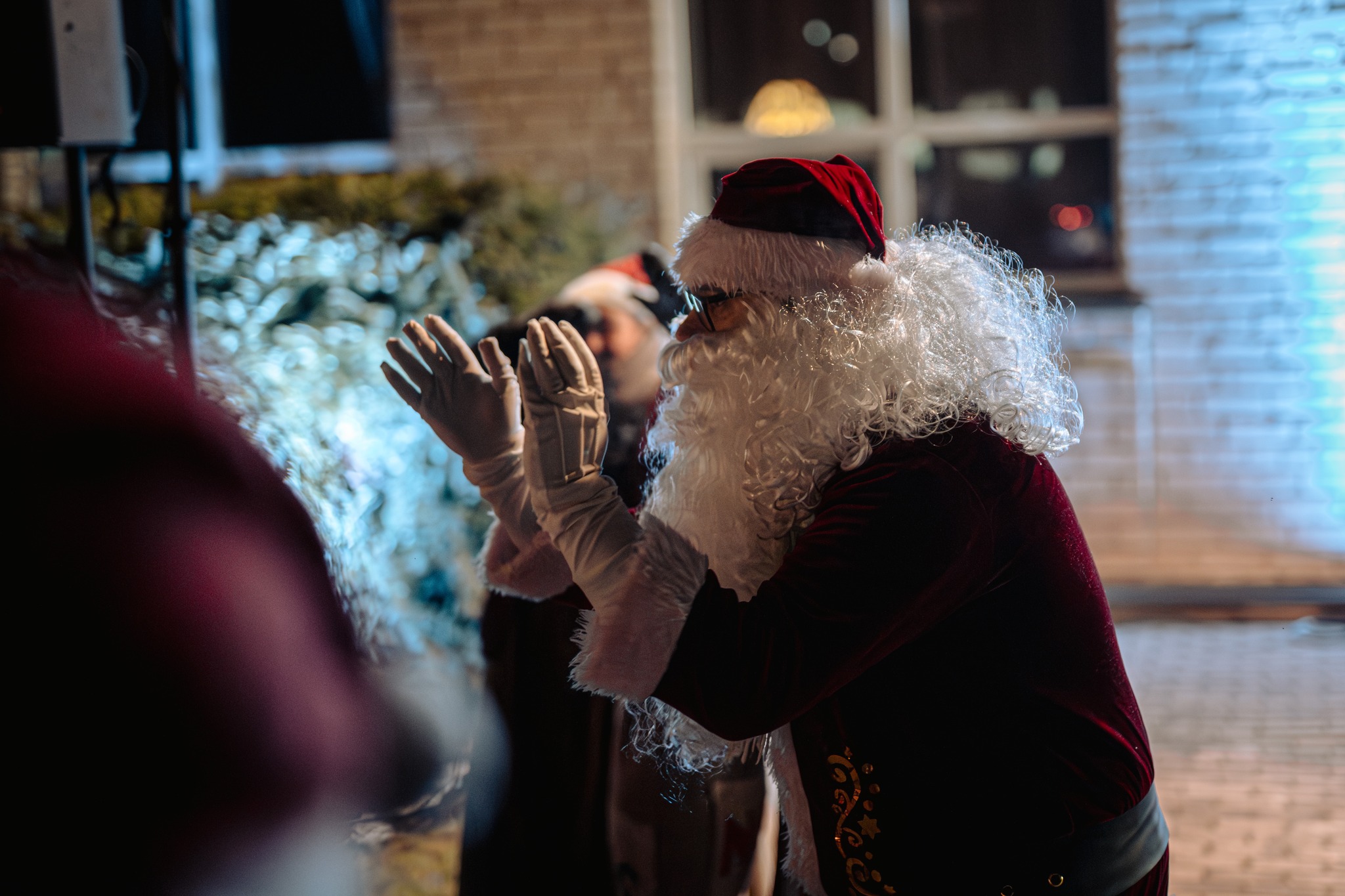 May be an image of lighting, christmas tree and crowd