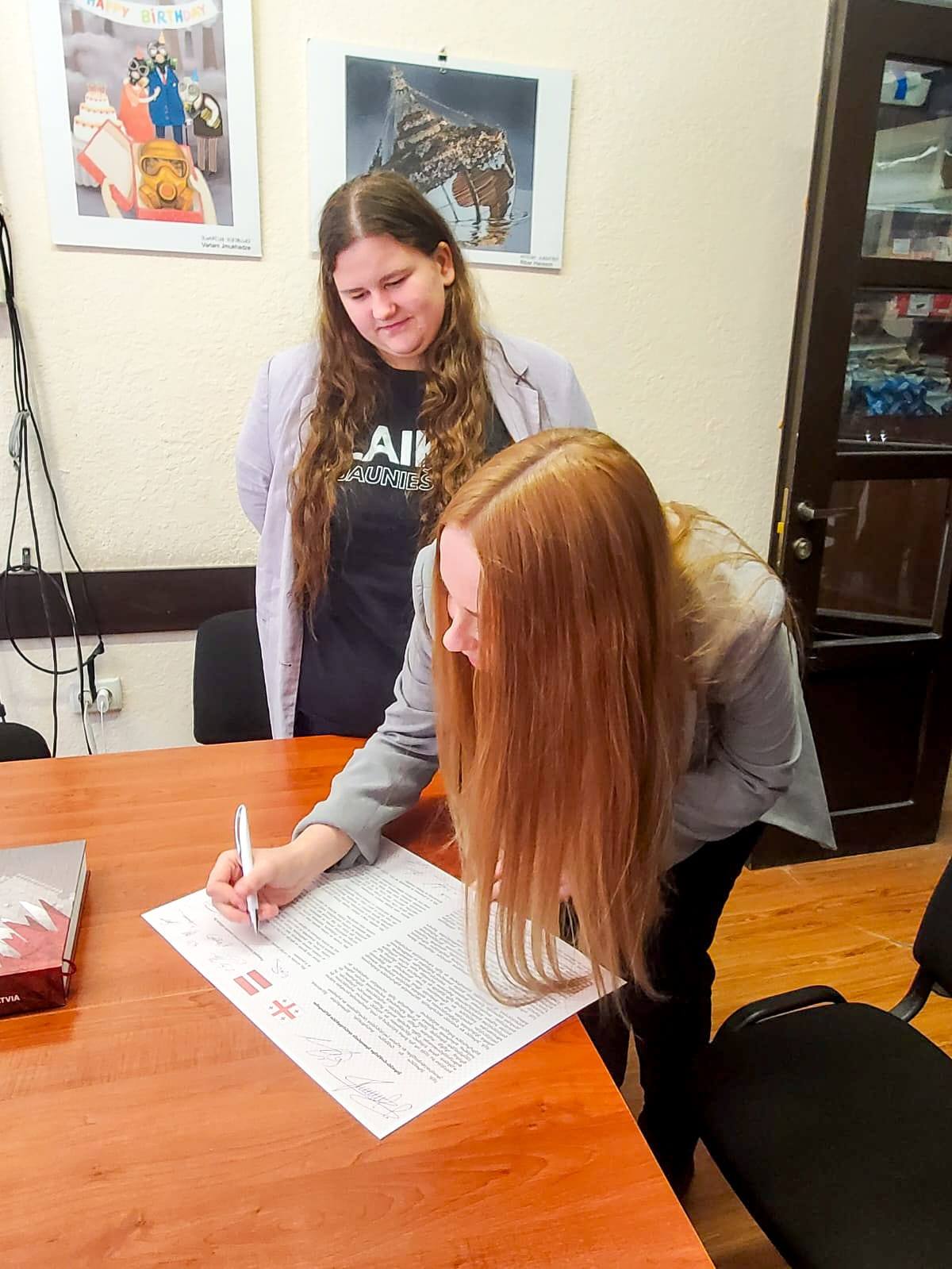 May be an image of studying and text