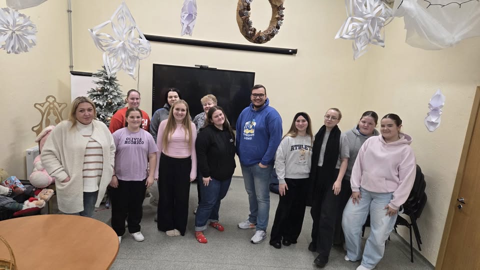 May be an image of smiling