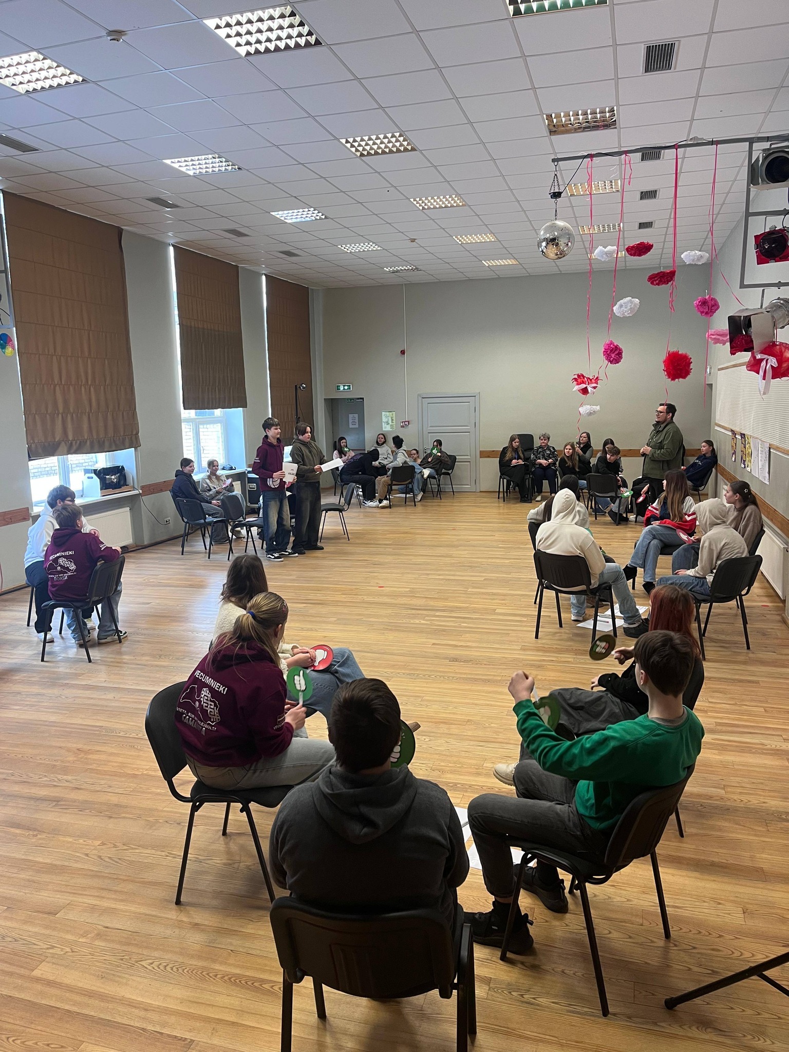 May be an image of studying, violin, flute and crowd