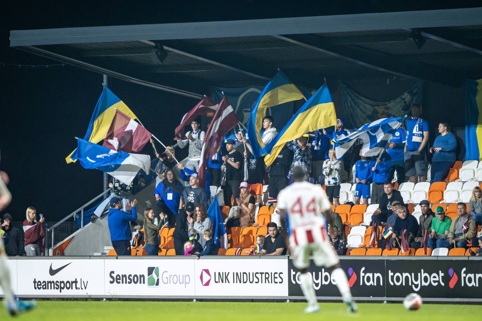 May be an image of soccer, football and text that says 'み 44 teamsport.lv Senson SensonGroup Group LNK INDUSTRIES to yba fan tonybet far'