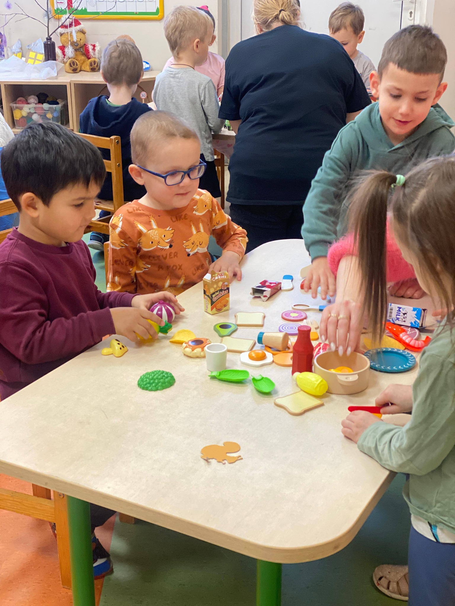 May be an image of gingerbread cookie, table and toy
