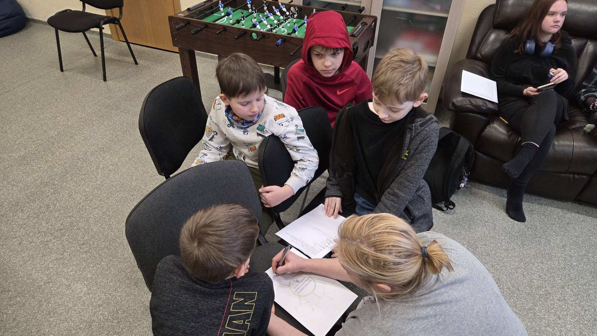 May be an image of studying and chess